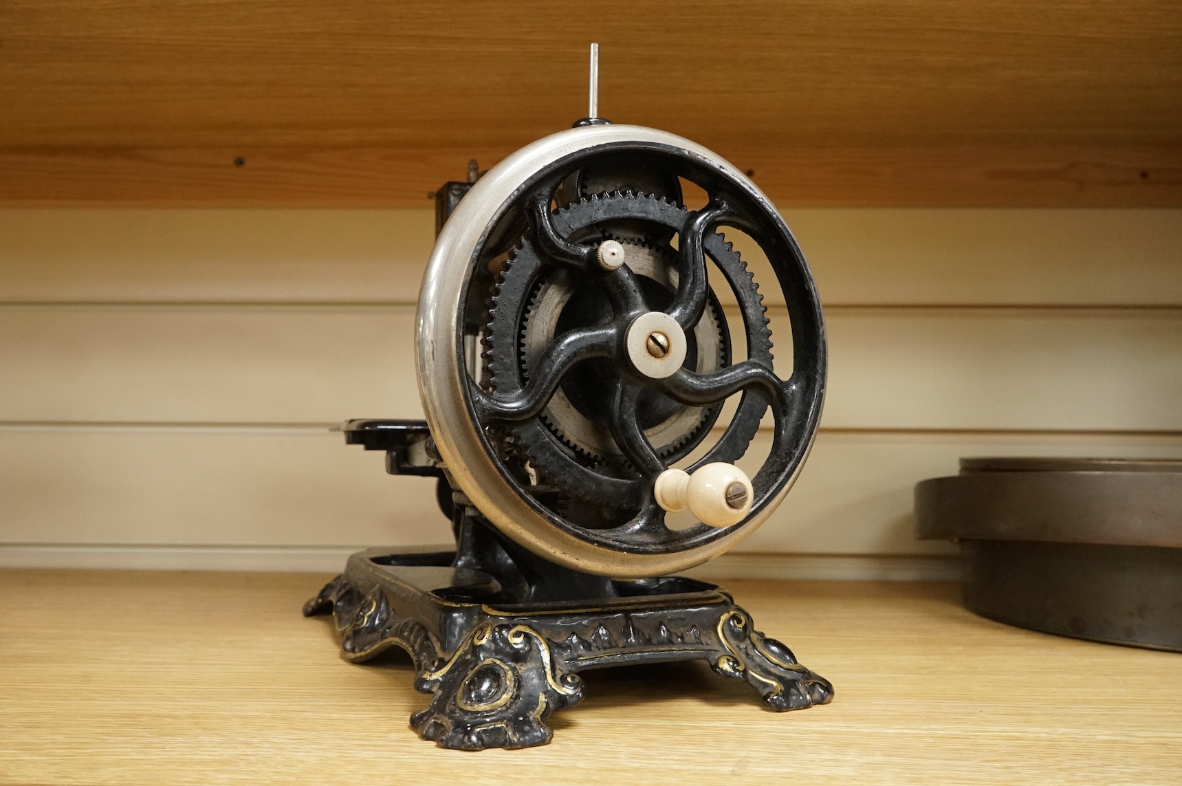 A late 19th century Wanzer sewing machine, in black enamel with gilt decoration.